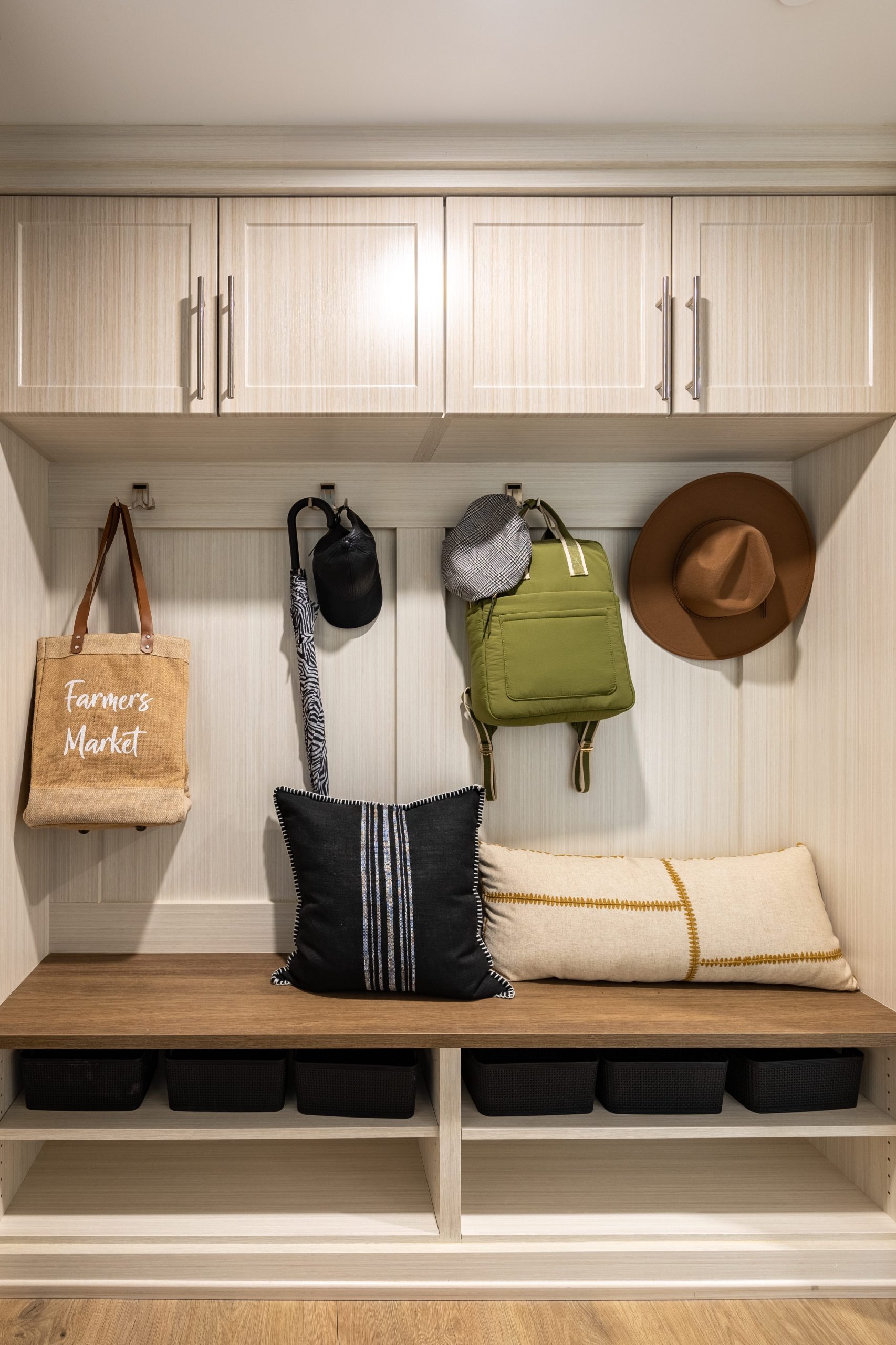 Mudroom and entryway storage system for entry way design Image of a mudroom storage systems for kids after school drop off.