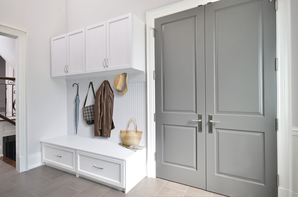 Mudroom Storage for Entry Ways Image of accessible jackets for orange county homeowners needing mudroom storage systems.